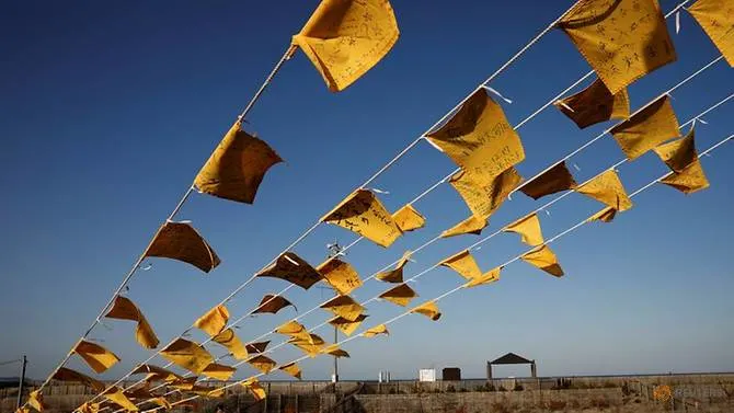 4727-yellow-handkerchiefs-with-messages-supporting-people-in-areas-hit-by-the-2011-earthquake-and-tsunami-are-hanged-ahead-of-the-10th-anniversary-of-fukushima-disaster-in-iwaki-1